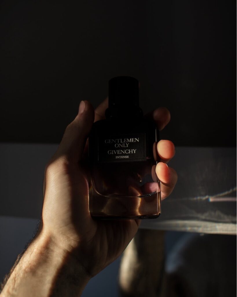 photo of person holding a gentlemen only cologne bottle by givenchy
